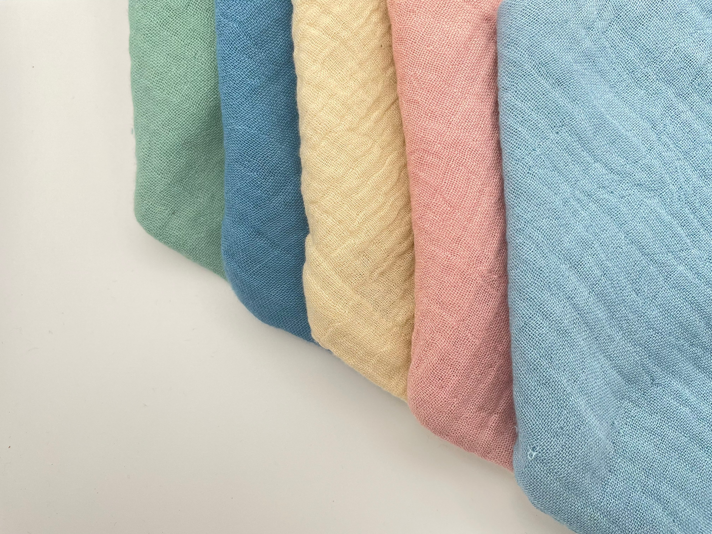 Sage, Whale Blue, Light Blue, Oat and Dusty Pink dribble bibs